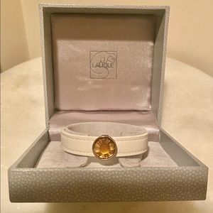 Lalique Flower Charm Bracelet with adjustable leather band.